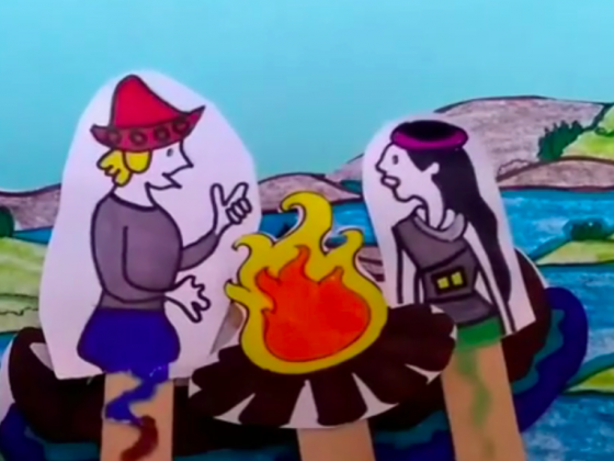 Telón de fondo que tiene dibujos de lagos. Delante del telón dos personajes dibujados a mano y sostenidos por palitos de madera