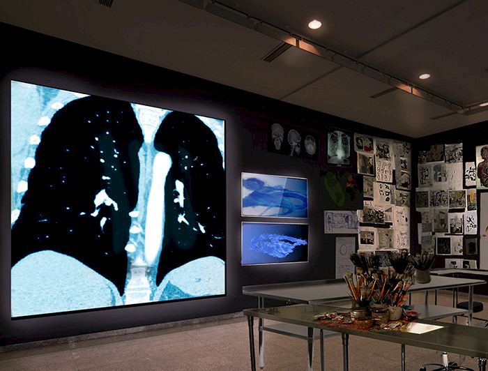 a room with a large black and white photograph on the wall