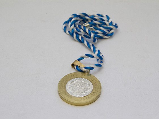 Medalla que reciben los profesores titulares