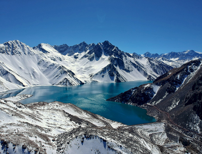 Lake in the middle of snow-capped mountains