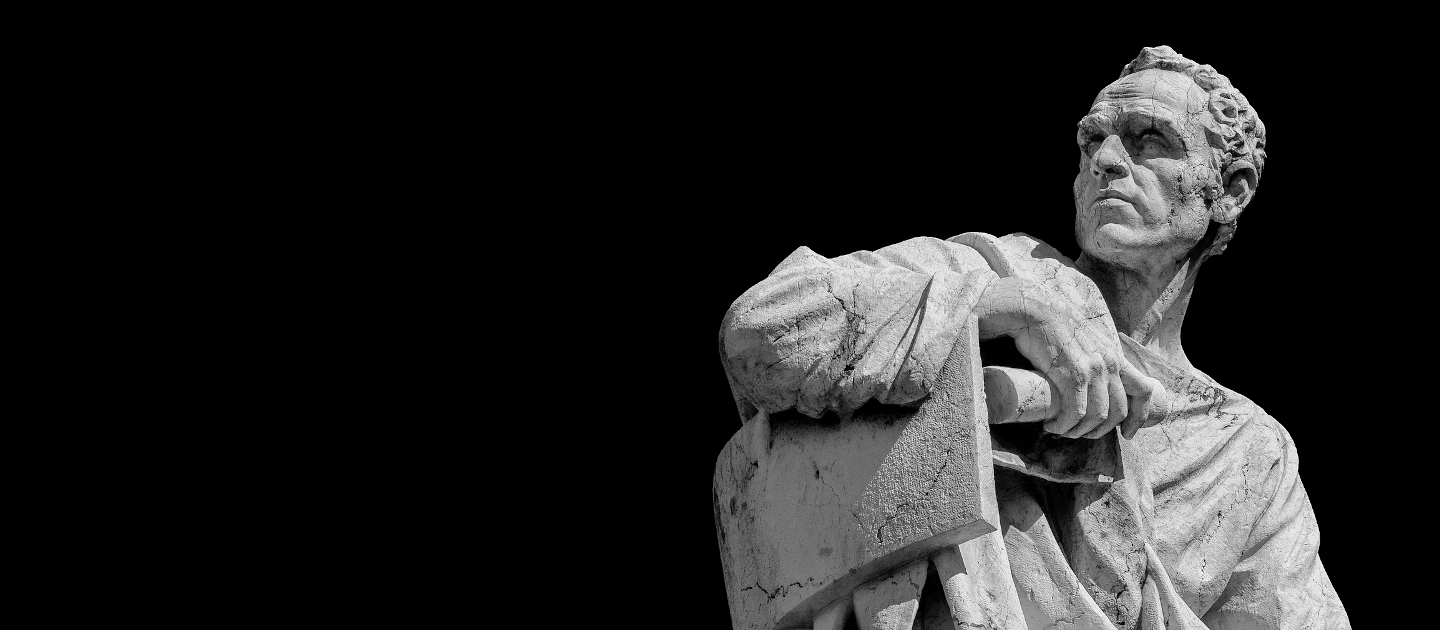 White Roman sculpture on black background